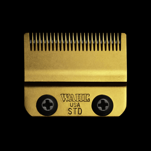 Gold hair clipper comb with 'WAHL USA STD' branding on a black background