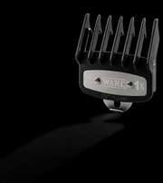 Wahl hair clipper comb on a black background