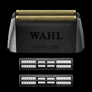 Wahl hair trimmer with multiple cutting heads on a black background