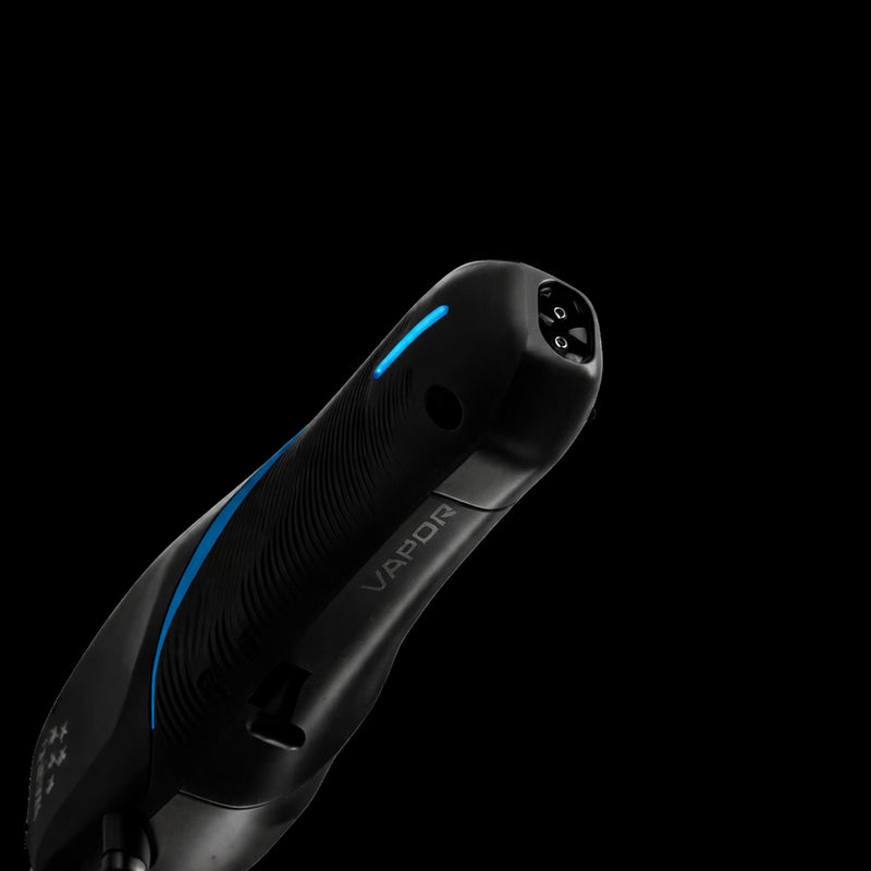 Wahl Vapor cordless clipper bottom angle showing charging port and blue LED. Primos Barber Supply